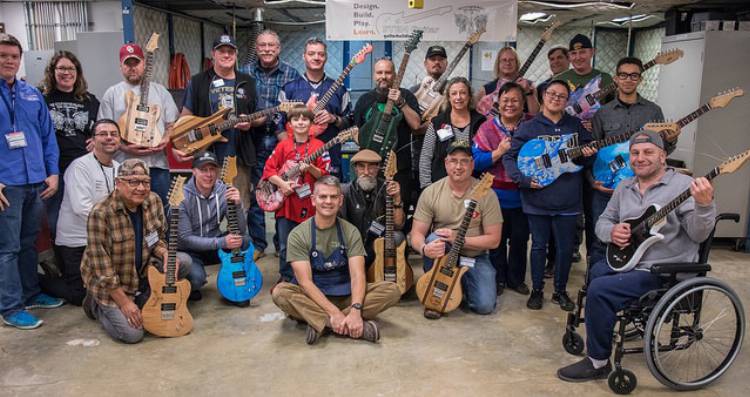Veterans with their newly-built guitars